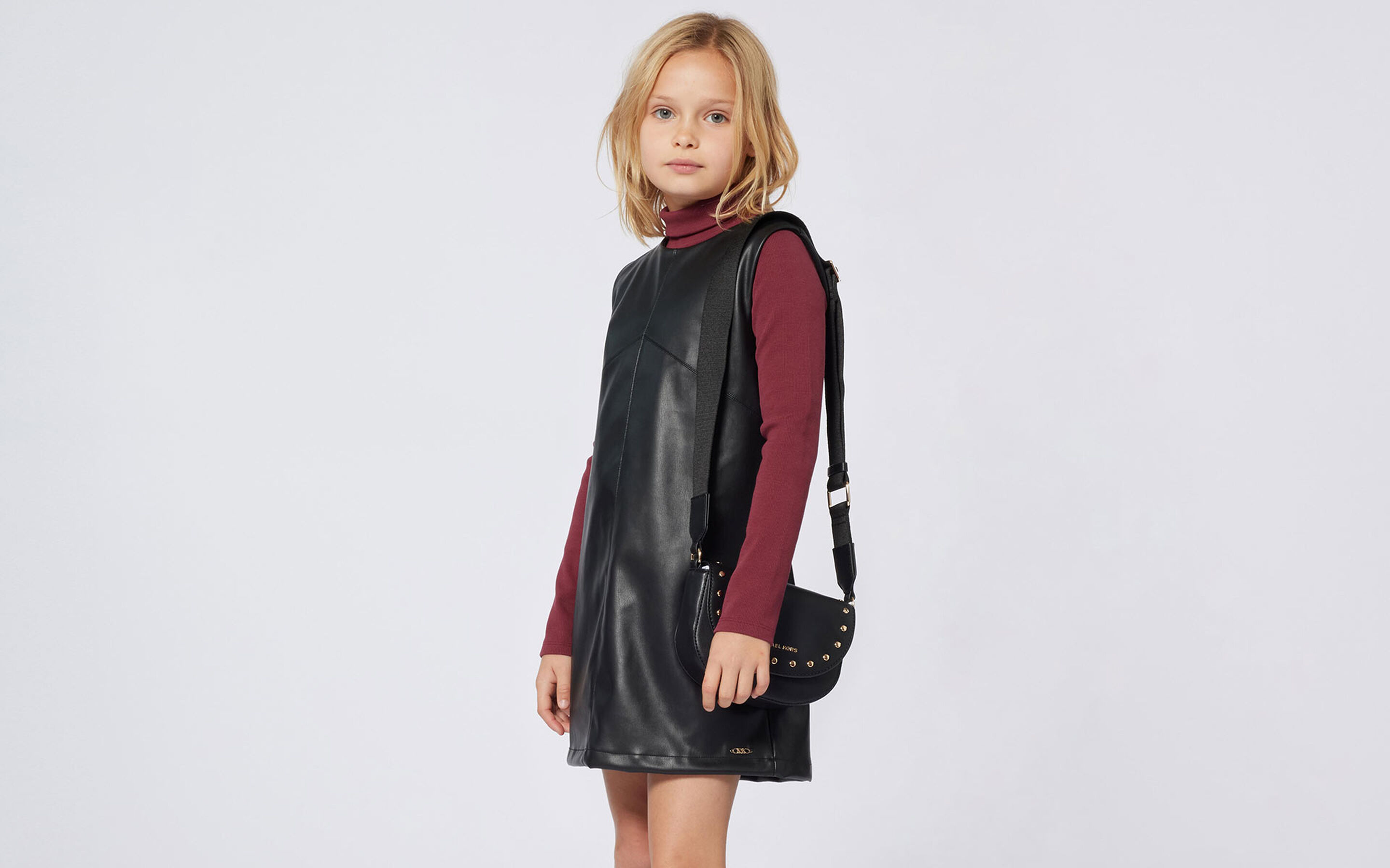 Dresses Michael Kors brand on kids around
